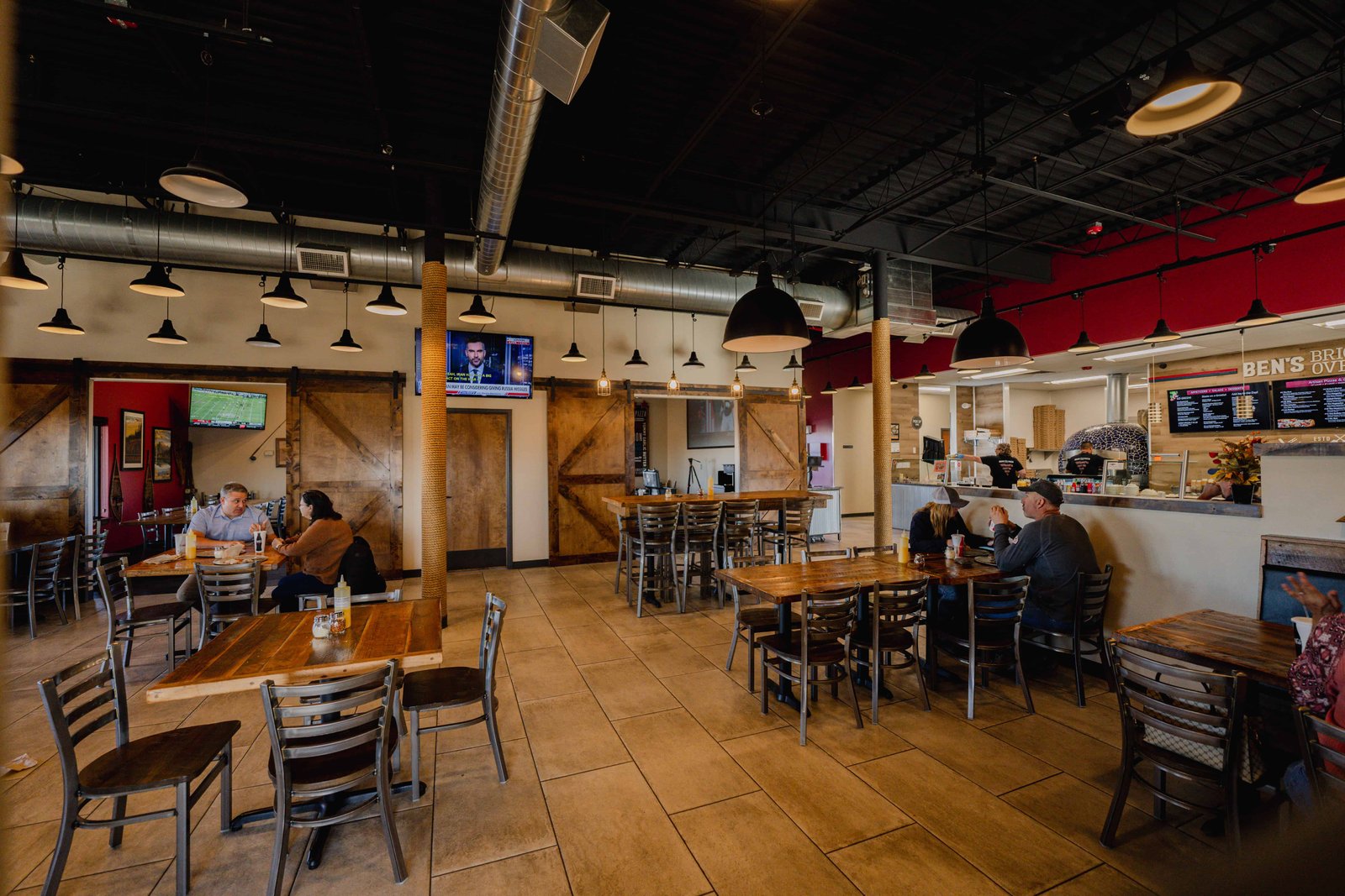 Ben's Brick Oven Pizza contemporary dining interior with warm lighting and family-friendly atmosphere
